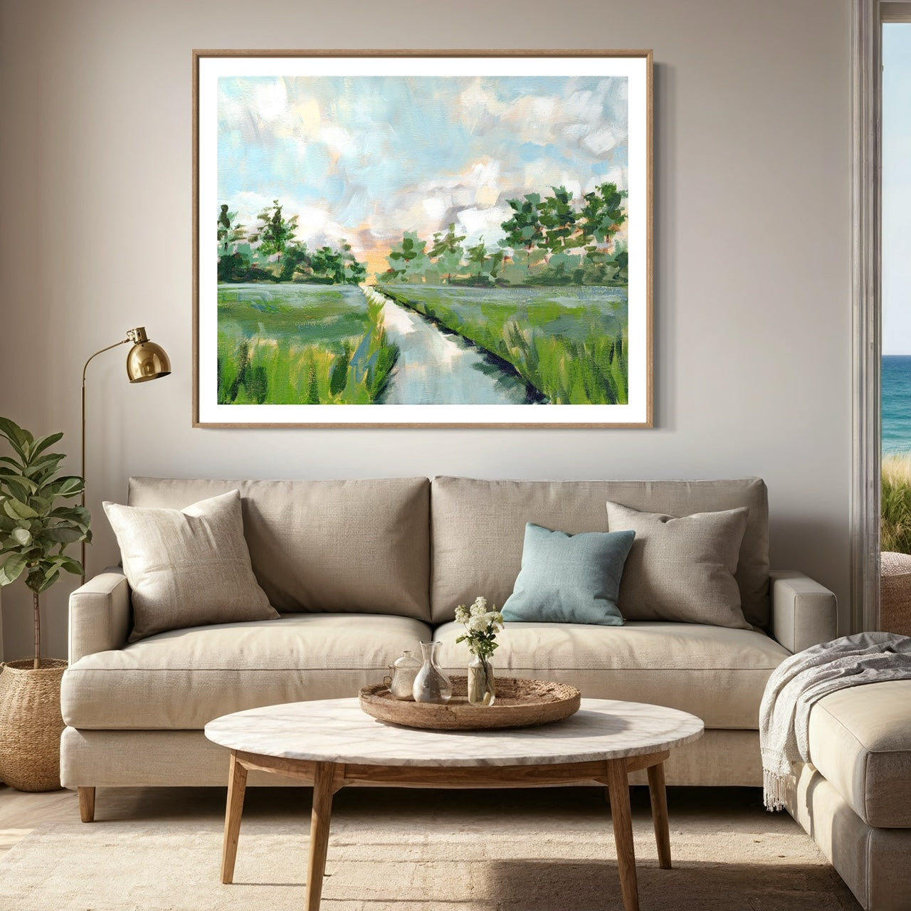 Coastal Oak One Landscape Art Print. Salt marsh fine art print with shades of blue and green framed and hung in neutral living room with blue and green accents.