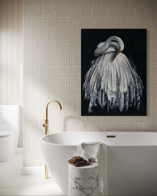 Bathroom with bathtub, art print of bird.
