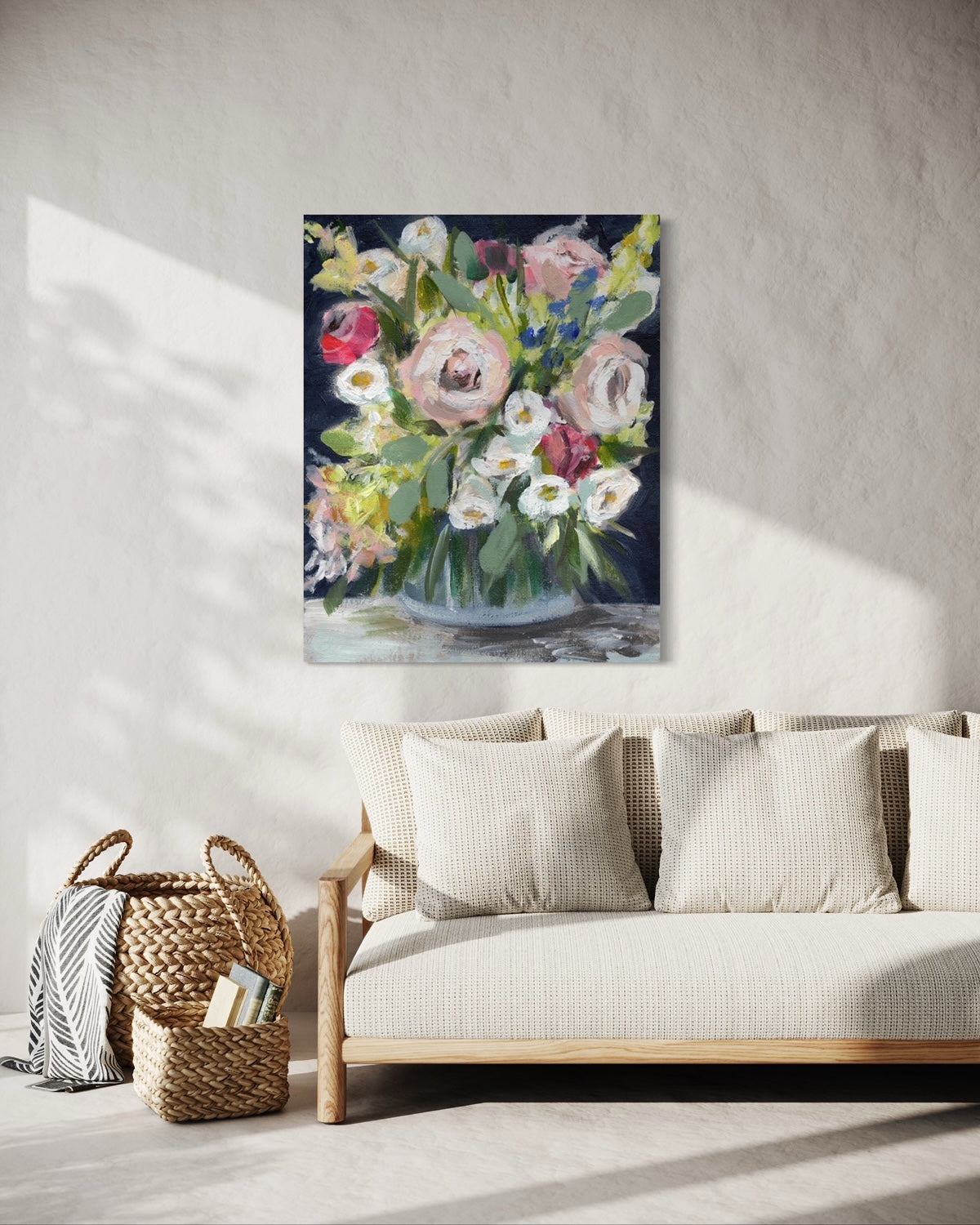 Painting of a floral arrangement above a couch.