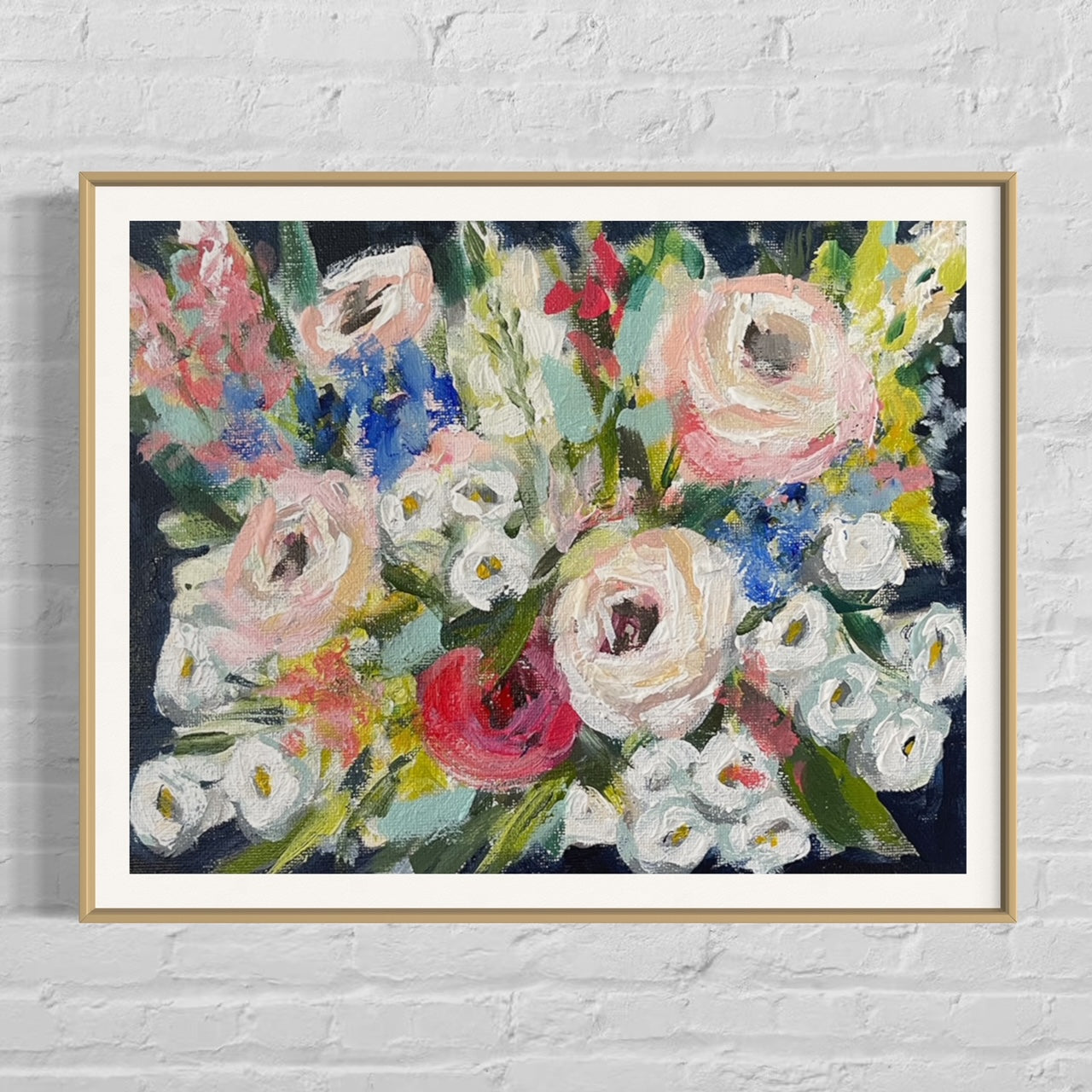 Painting of colorful flowers in a gold frame.