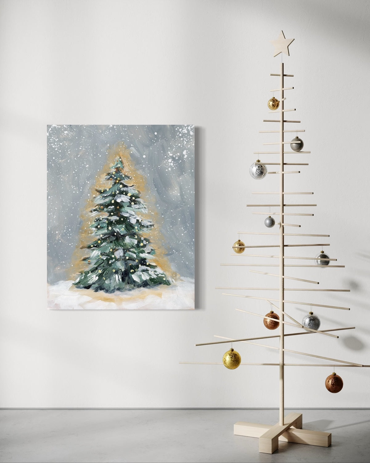 Painting of a snowy tree next to a minimalist Christmas tree.