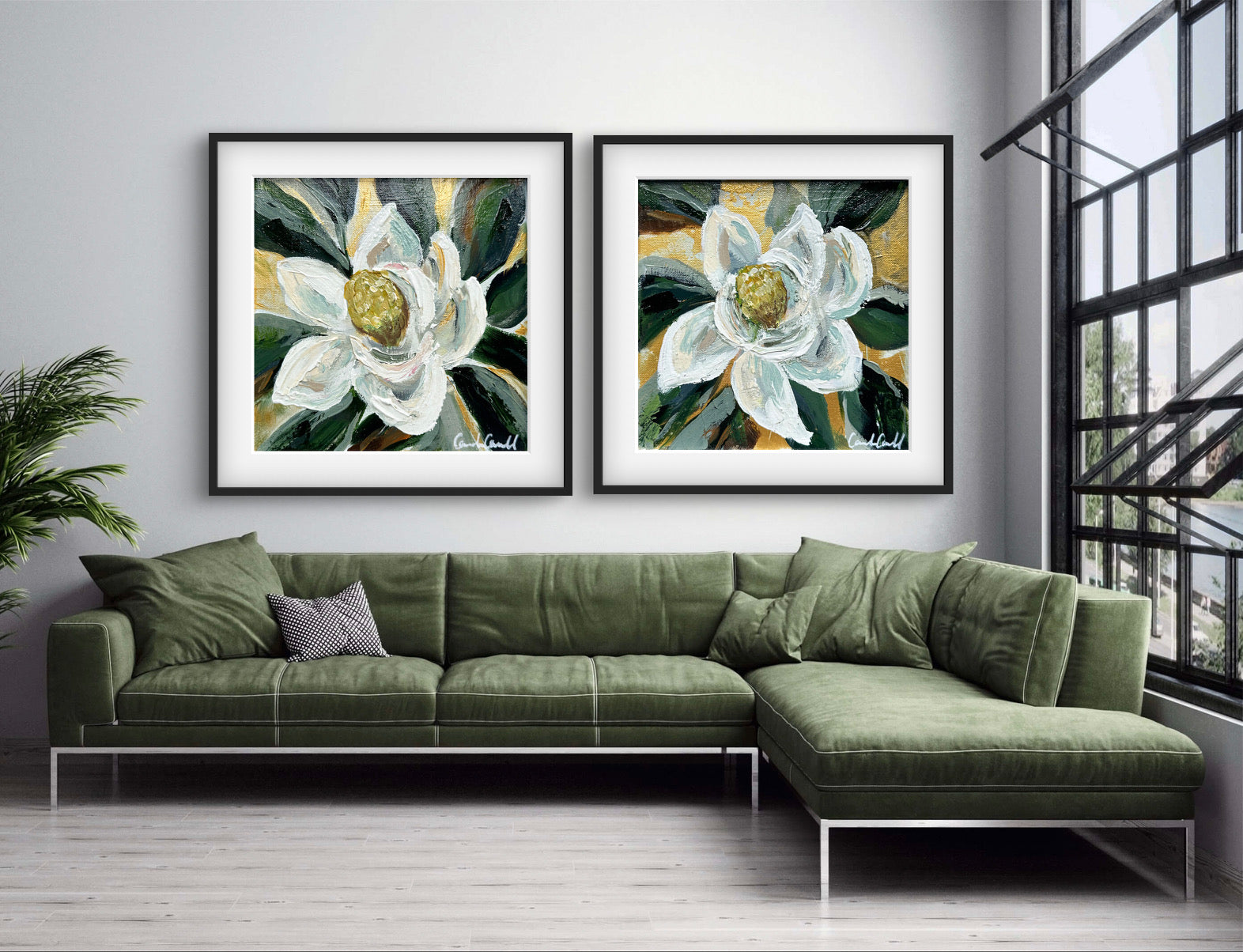 Two framed flower paintings above a green sofa.