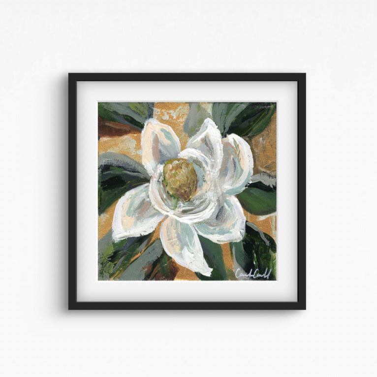 Painting of a white magnolia flower in a black frame.