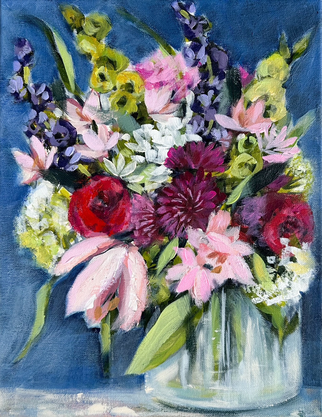 Bouquet of colorful flowers in a glass vase.
