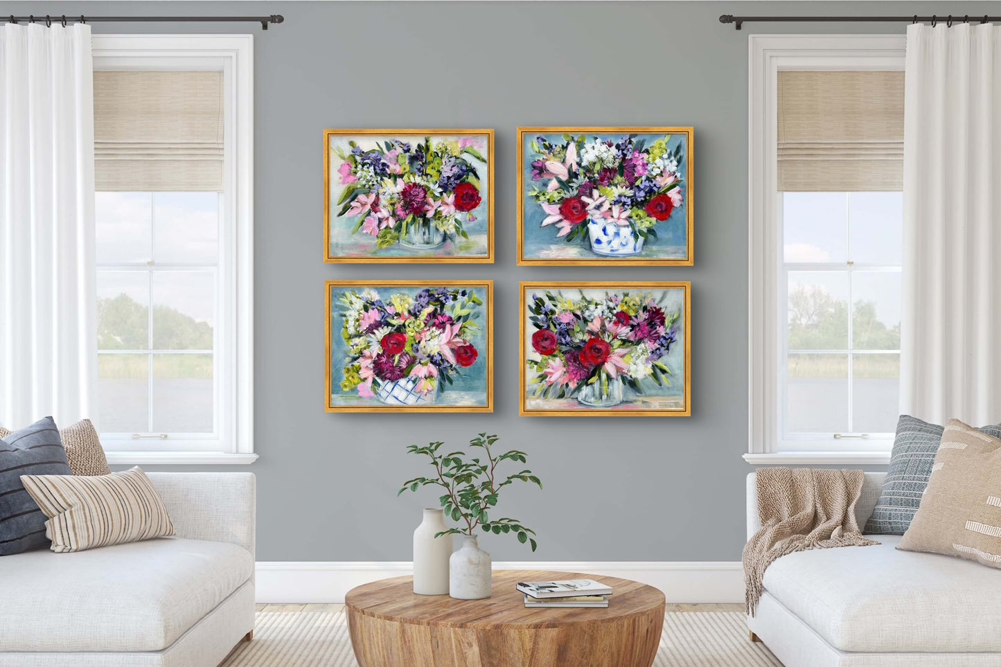 Four floral paintings on a gray wall.
