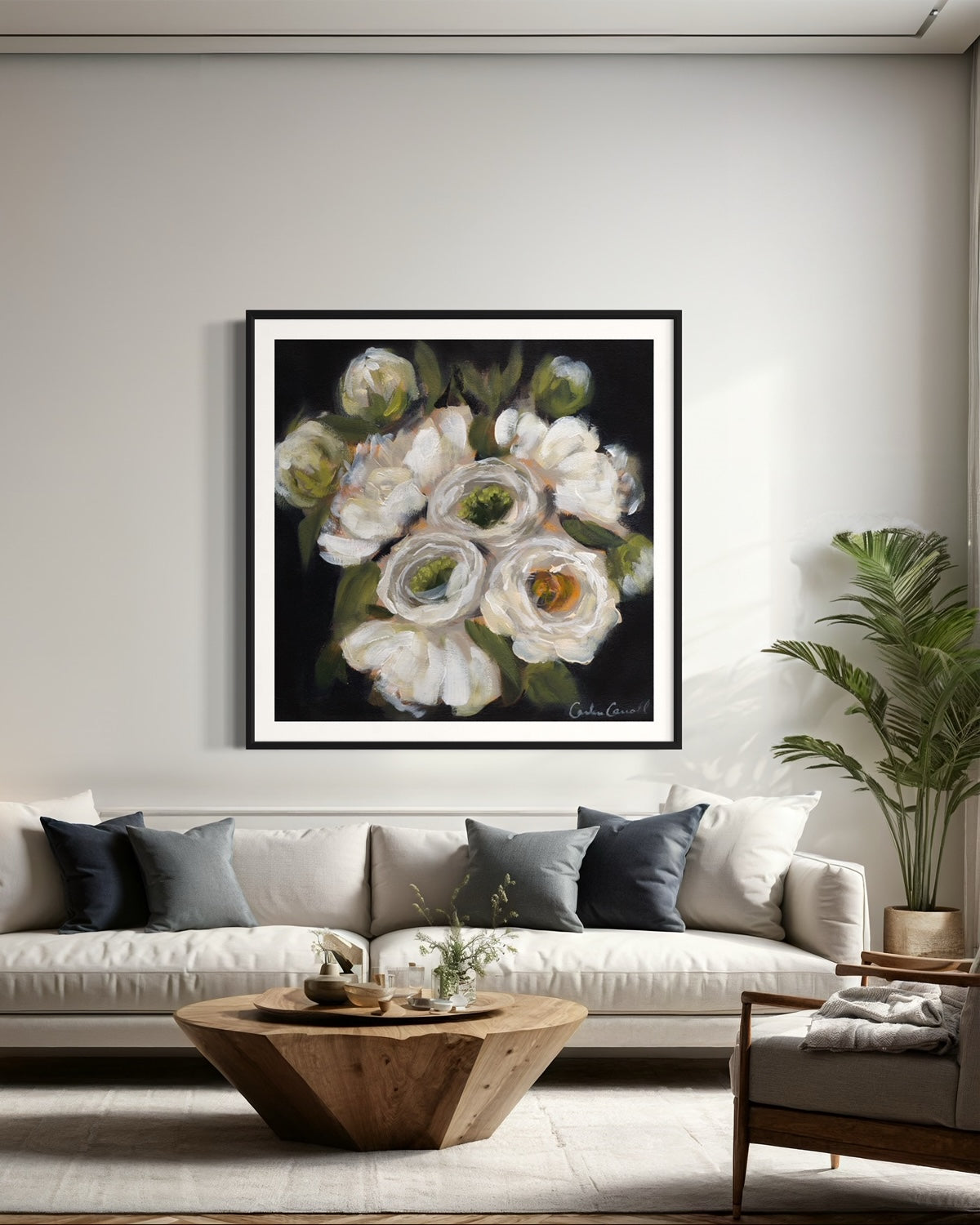 White Peonies on dark background framed in black frame on living room wall