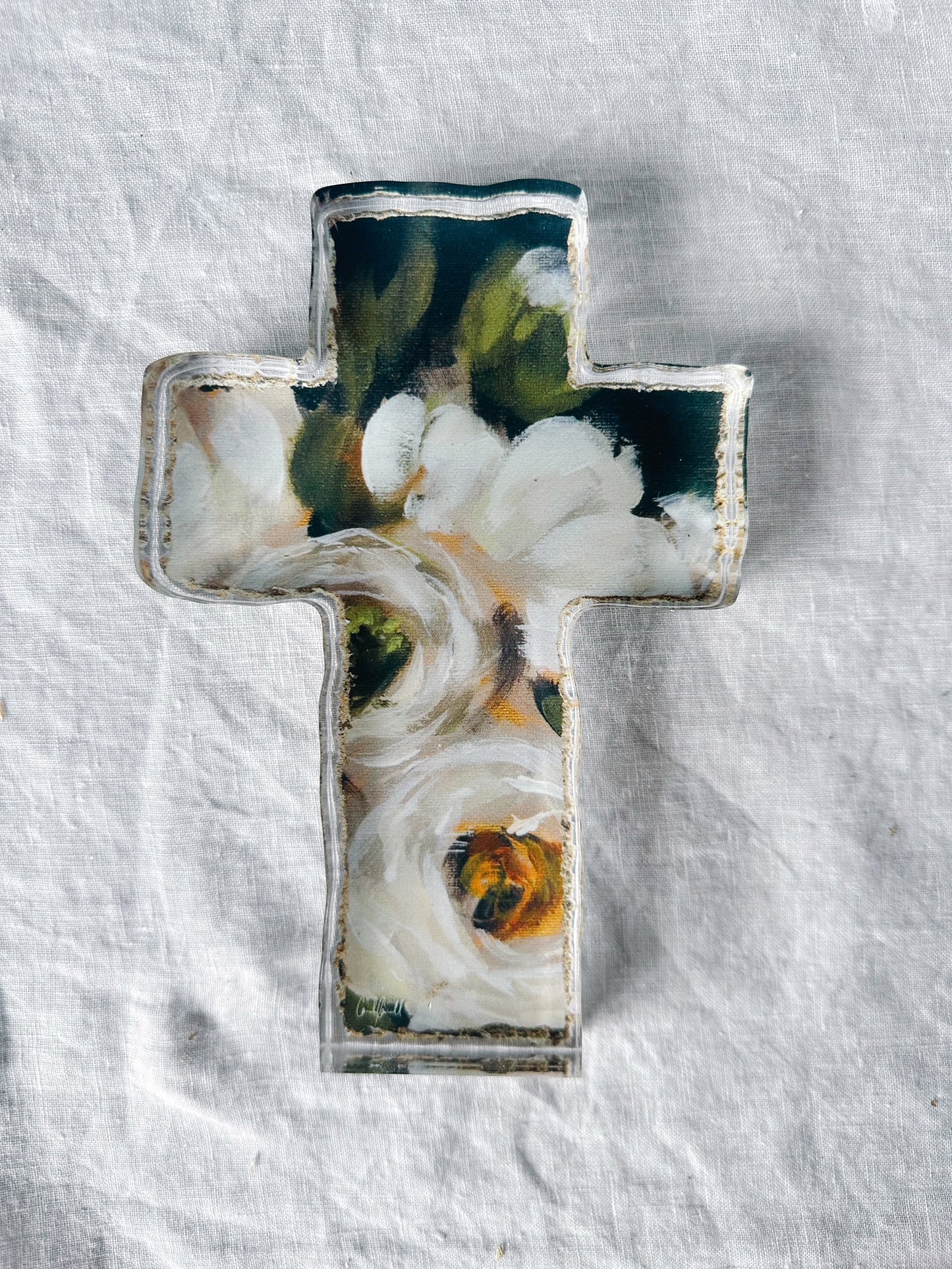 black and white floral art acrylic cross laying on white background