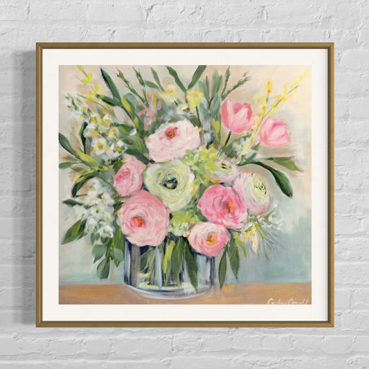 floral art print of pink and white peonies with yellow forsythia softly accented by a soft-lit grey background framed in gold frame on white brick wall