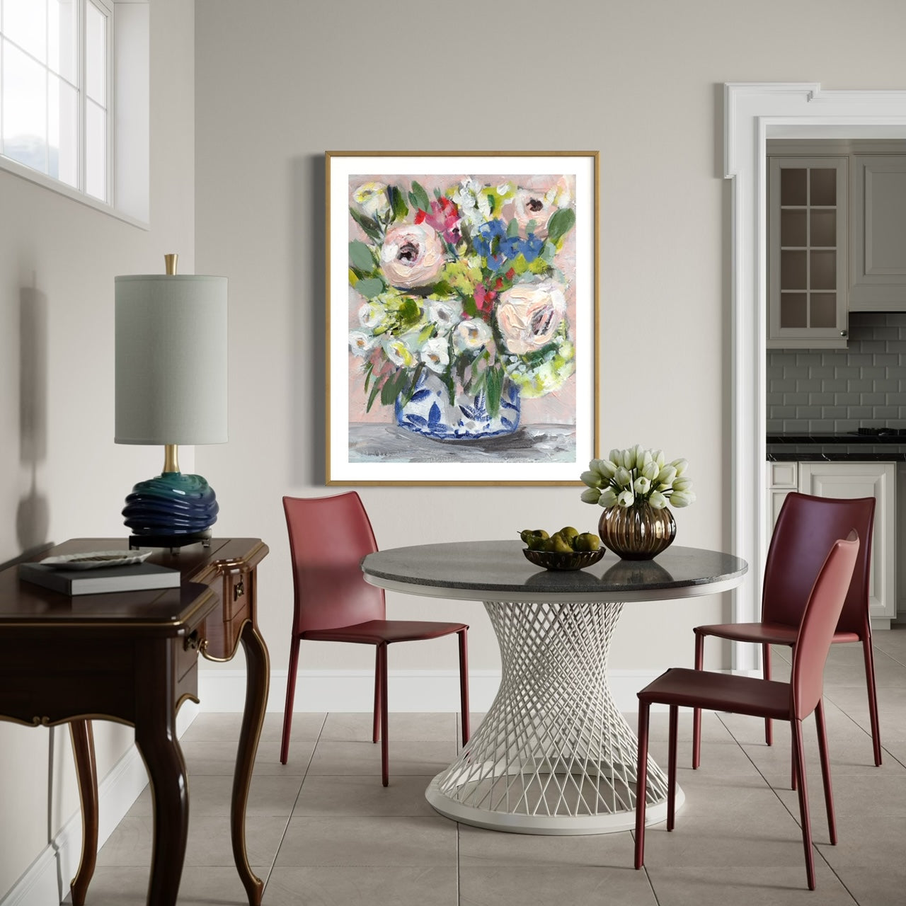 floral art print with pink peonies, white, red and blue flowers on pink background in dining room setting