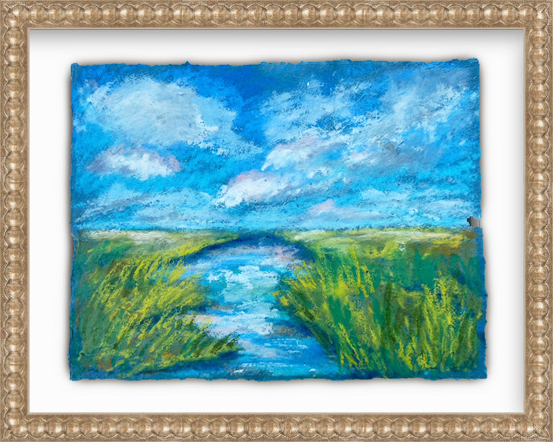 Framed painting of a landscape with a river and blue sky.