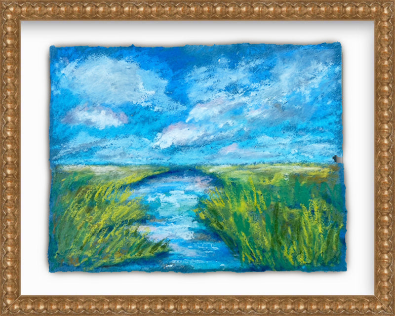 Painting of a landscape with a river and blue sky, framed in gold.