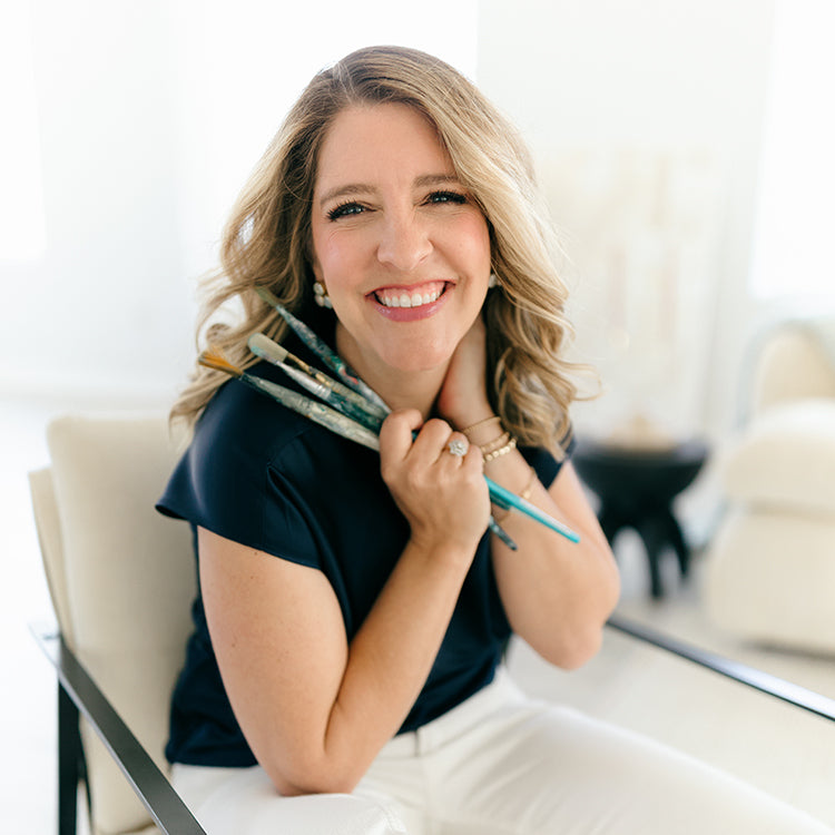 Smiling artist with paintbrushes - profile pic