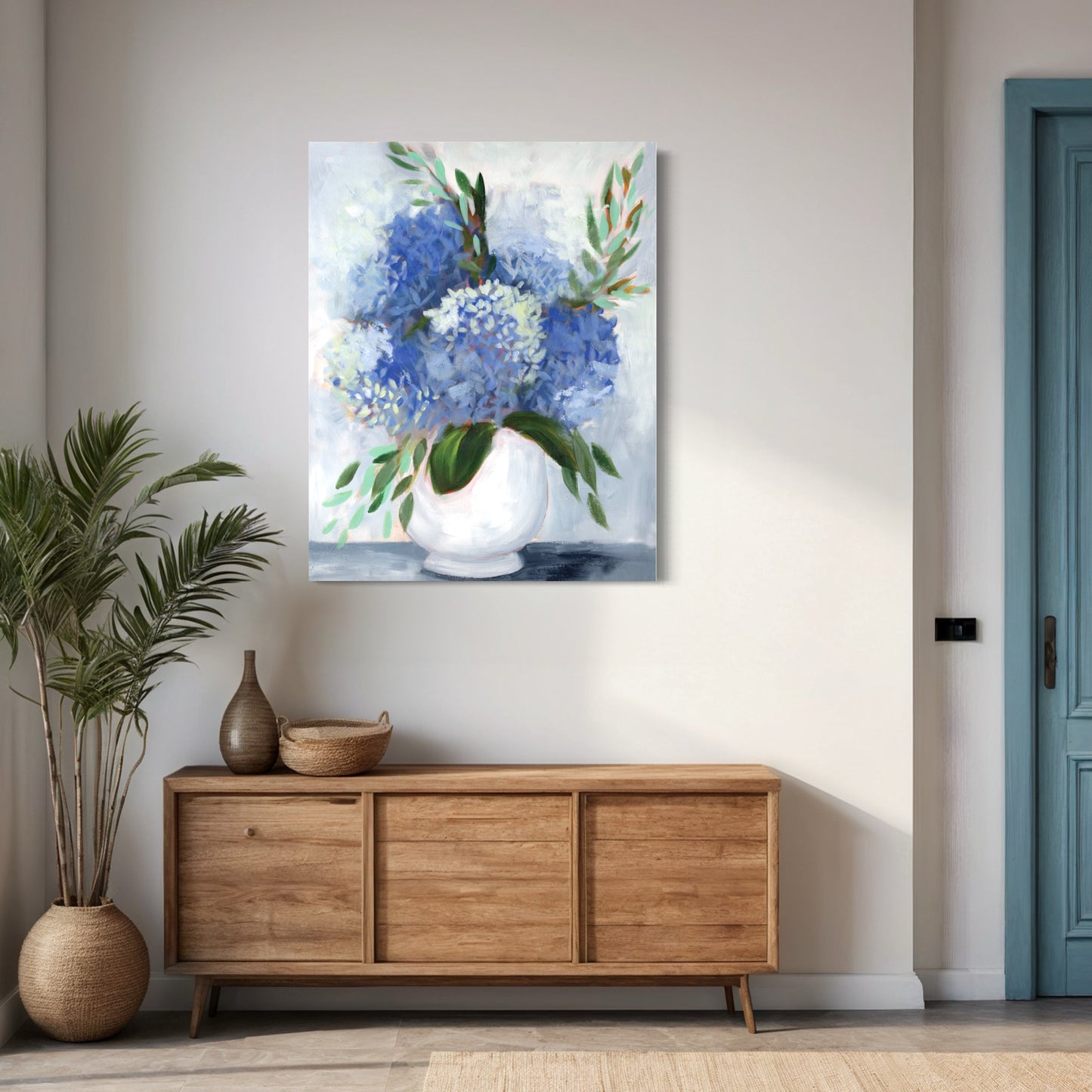 blue and white hydrangea art print in hallway with blue door