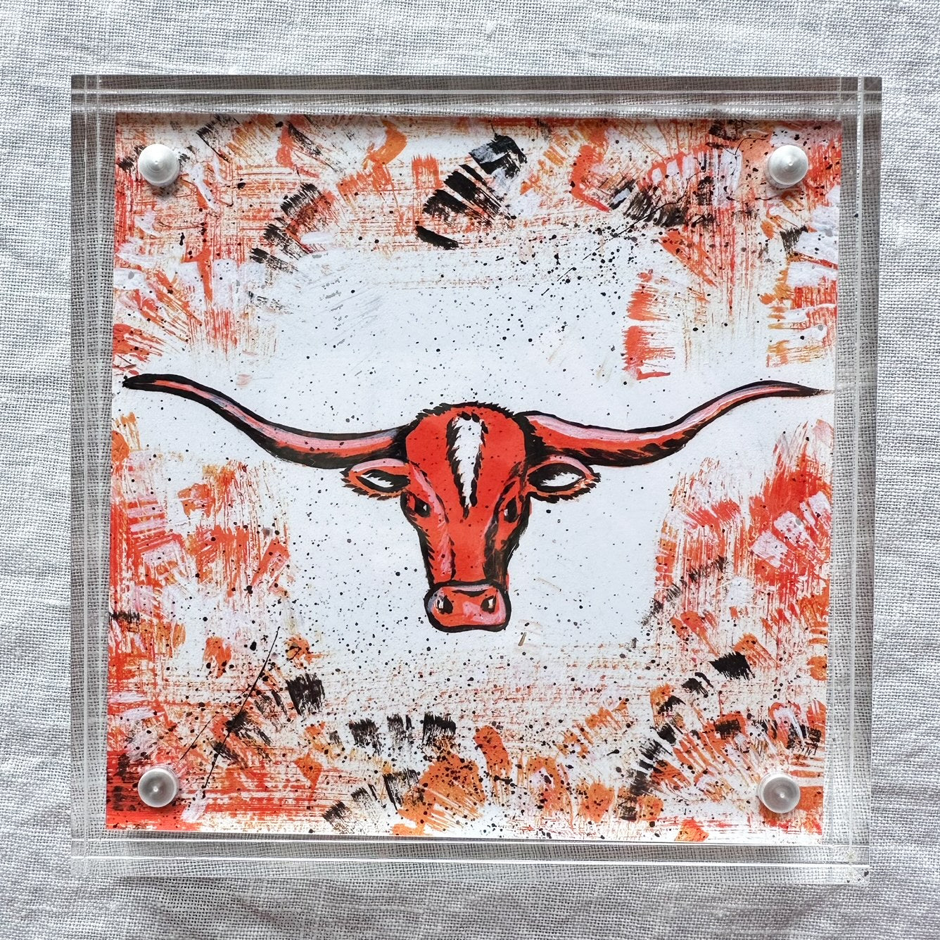 University of Texas Longhorn Mascot Art Print with a background of burnt orange with black and white accent colors. Framed in acrylic art frame.