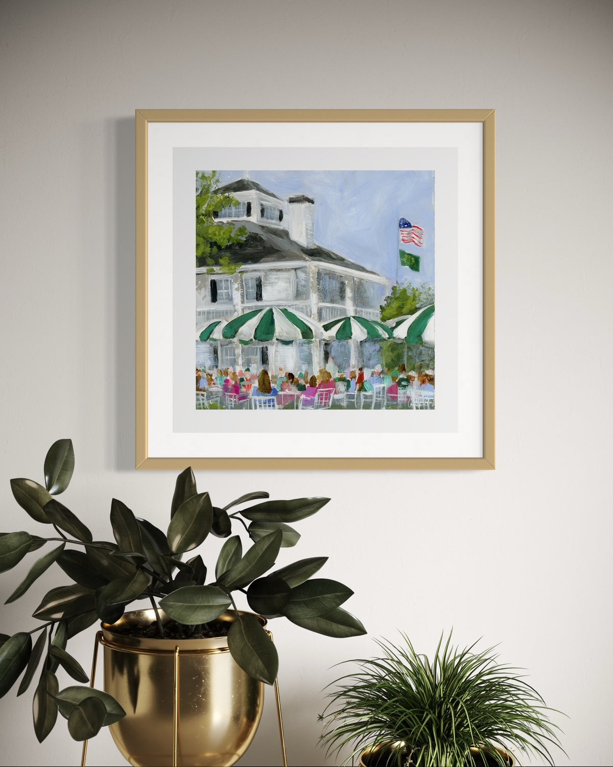 augusta nationals clubhouse golf art print with gold frame on neutral wall with plants