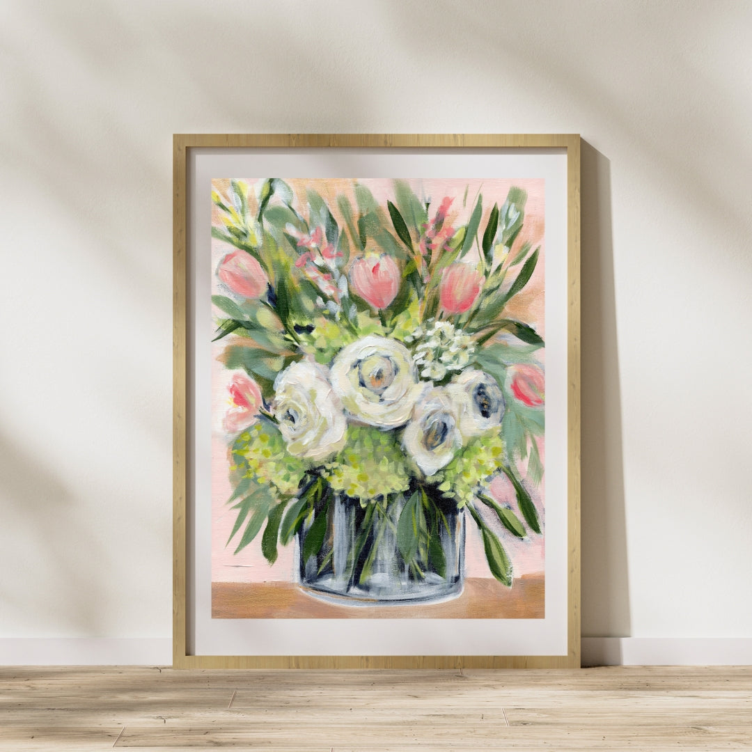 White peonies, green hydrangeas and pink tulips art print on pink background in frame leaning against the wall