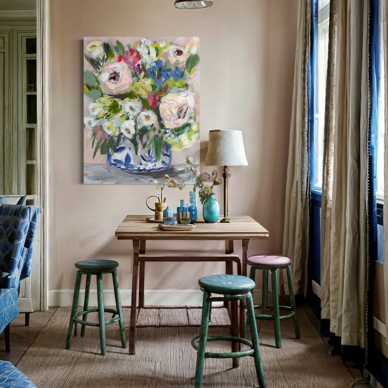 floral art print with pink peonies, white, red and blue flowers on pink background in cozy dining room 
