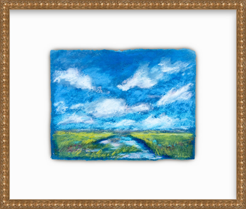 Framed painting of a landscape with a blue sky and green fields.