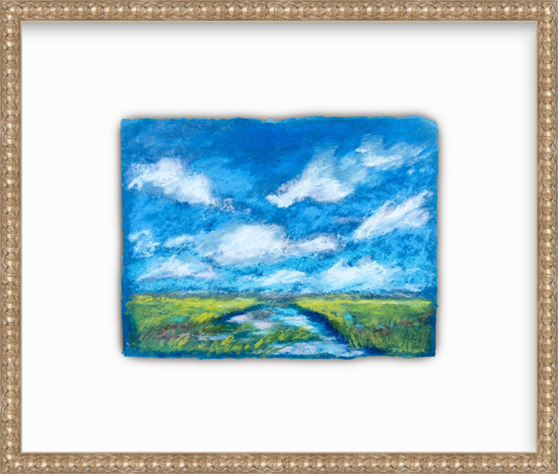 Framed painting of a landscape with a blue sky and green fields.