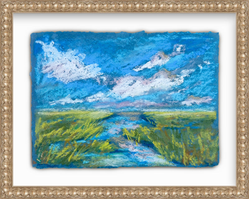 Framed painting of a landscape with blue sky and green fields.