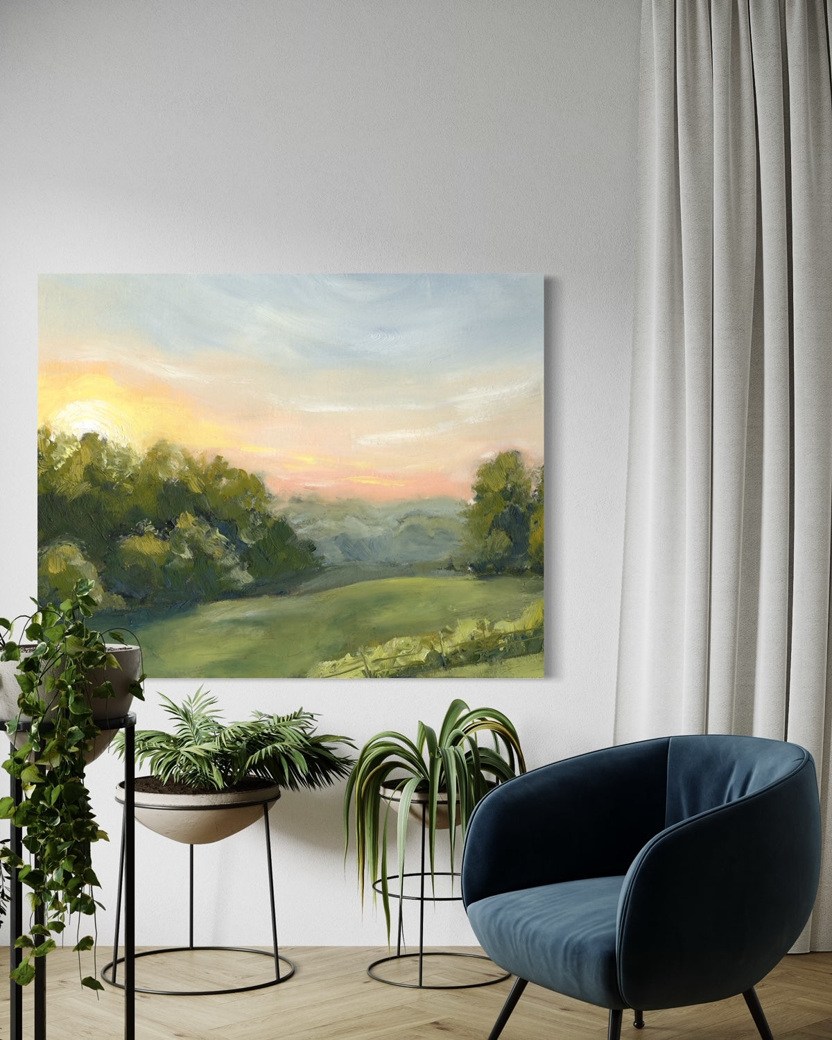 Canvas print of a field at dawn. captures the tranquil beauty of a pink sunrise over an expansive field. on wall with blue chair